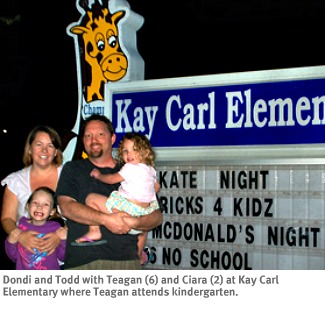 Photo of WriteSteps Common Core staffers Dondi and Todd Daugherty with daughters Teagan and Ciara at Teagan's school.