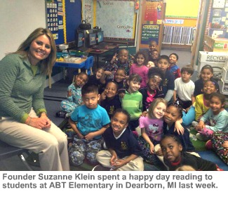 Photo of Suzanne Klein with students at ABT Elementary School.